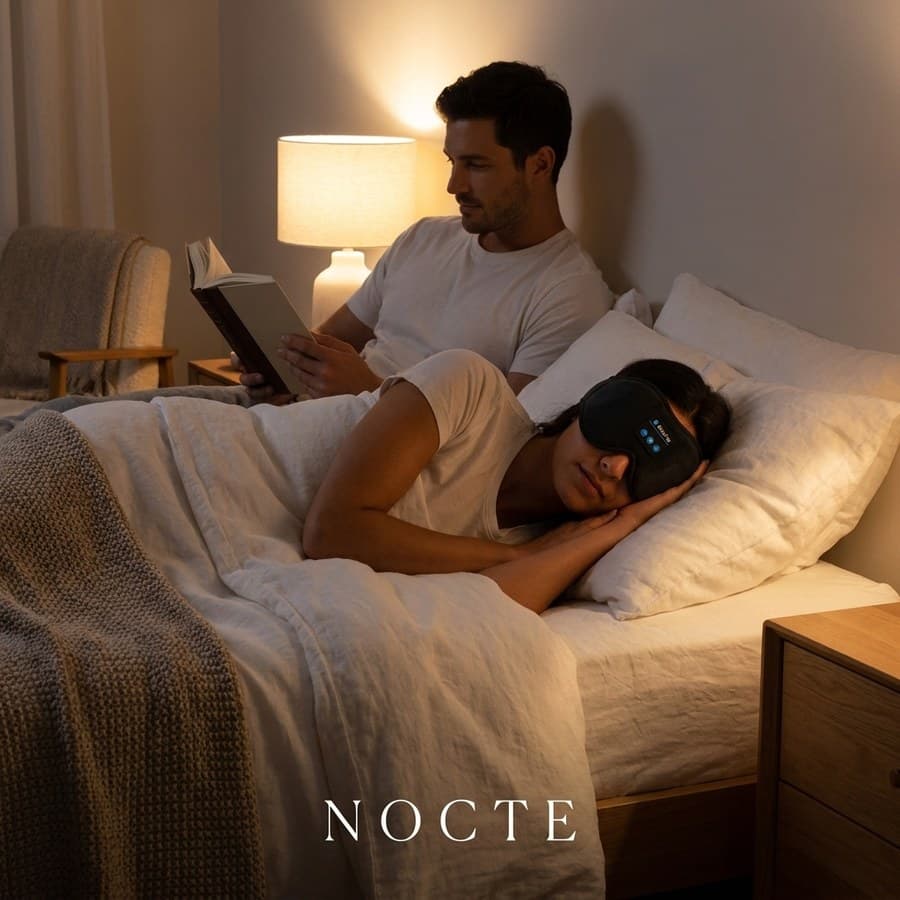 One partner asleep in the mask while the other reads